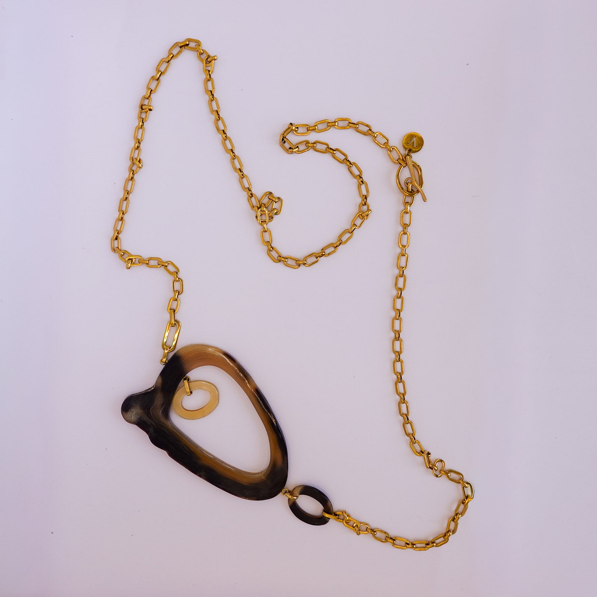 Sautoir doré pendentif effet corne anneau asymétrique x AFRICA