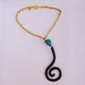 Collier doré pierre turquoise et pendentif spiralé en fer forgé x AFRICA